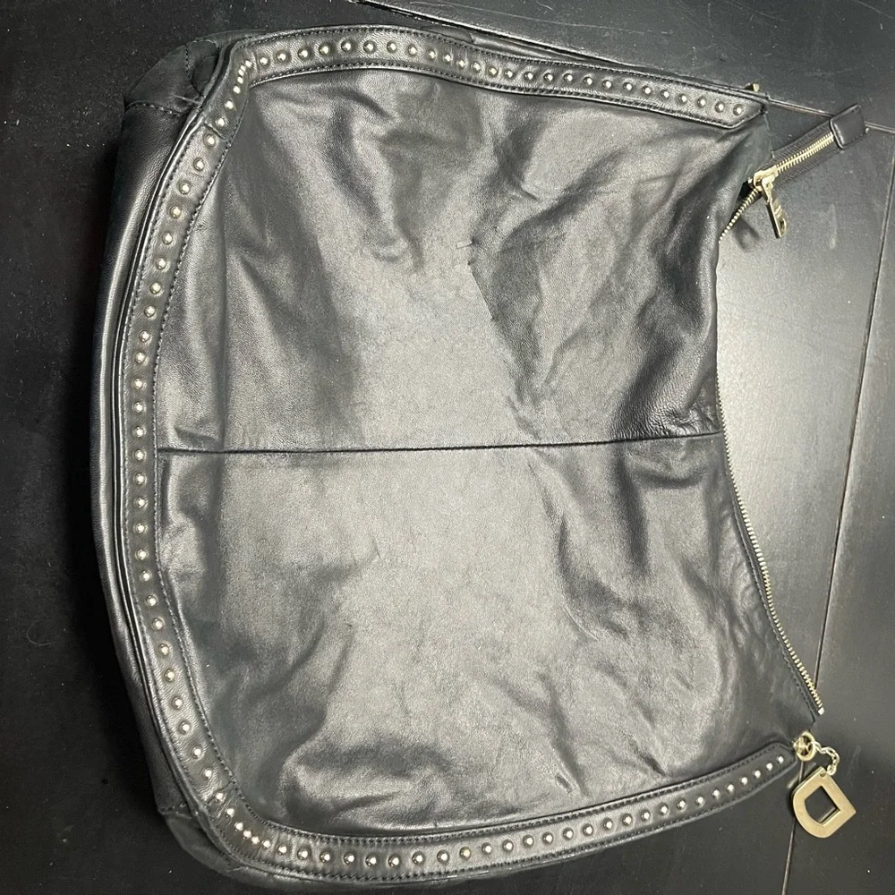 DKNY black leather shoulder bag with stud detailing.
